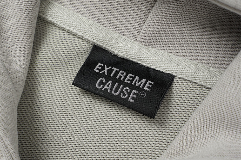 Sweat à capuche oversize zippé – Finition délavée usée, poches à multiples zips et bords bruts
