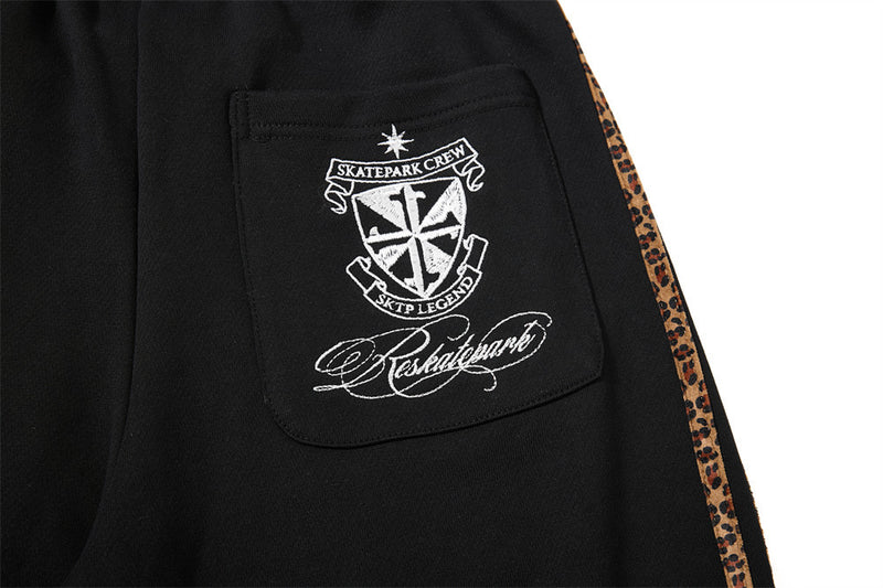 Dark Streetwear Wide-Leg Sweatpants with Leopard Side Tape & Script Print