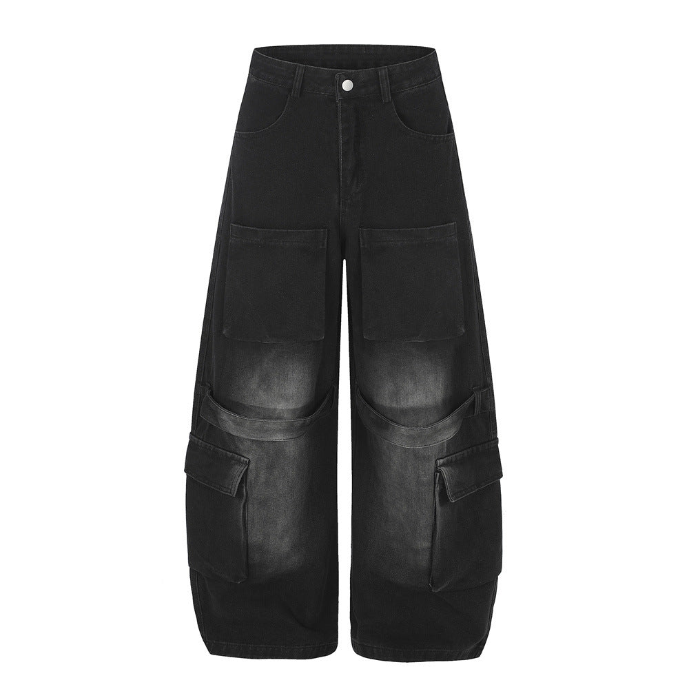 Men's baggy wide-leg cargo jeans in washed black denim with oversized multi-pocket detailing