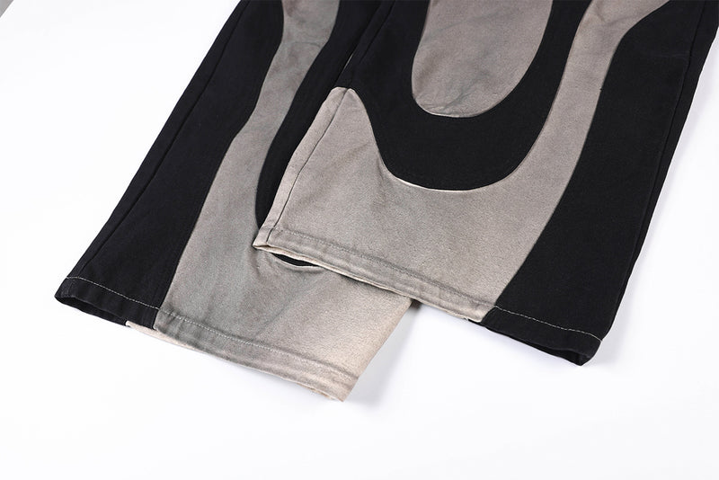 Wide-Leg-Patchworkhose – abstraktes Wellenmuster aus zweifarbigem, schwarz-grauem Washed-Denim