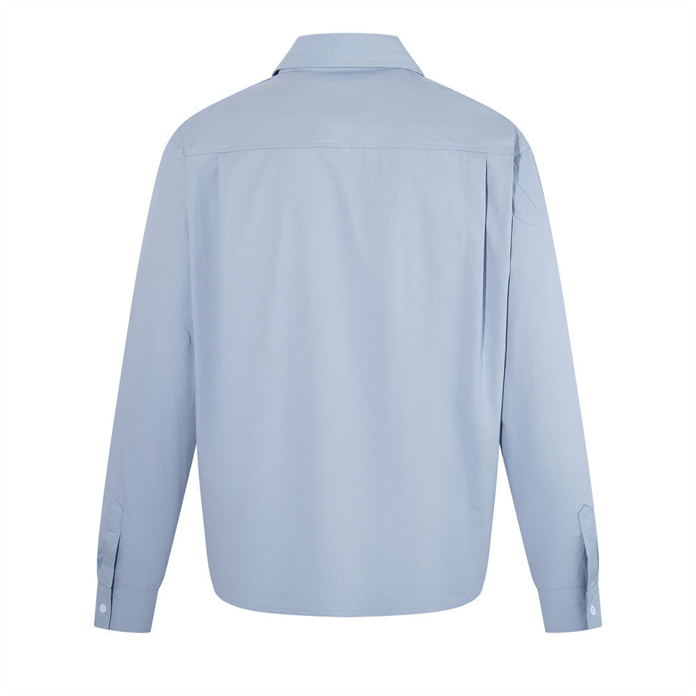 Light blue long sleeve pullover shirt shown from the back with button cuffs