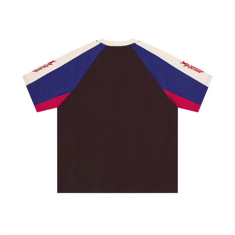 Back view of black colorblock soccer-style tee with blue, red, and cream sleeves