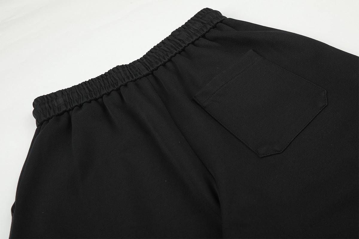 Pantalon de survêtement à jambes larges avec délavage dégradé et plis aux genoux