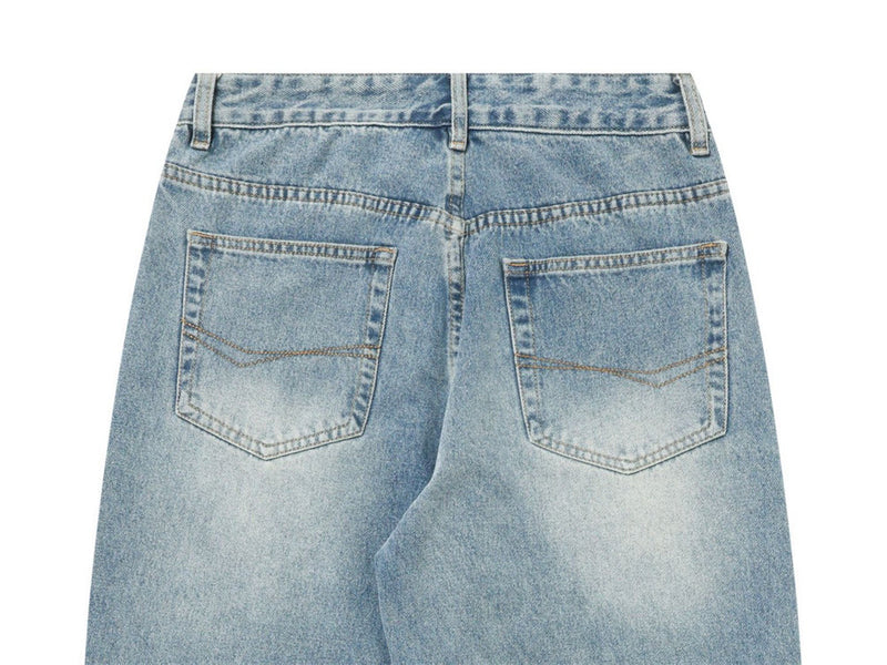 Close-up of light blue jeans back view with two patch pockets