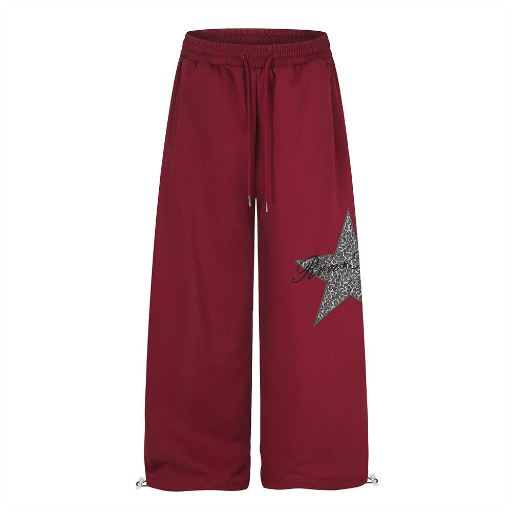 Wide-leg sweatpants with leopard-print star patch and drawstring hem in burgundy red