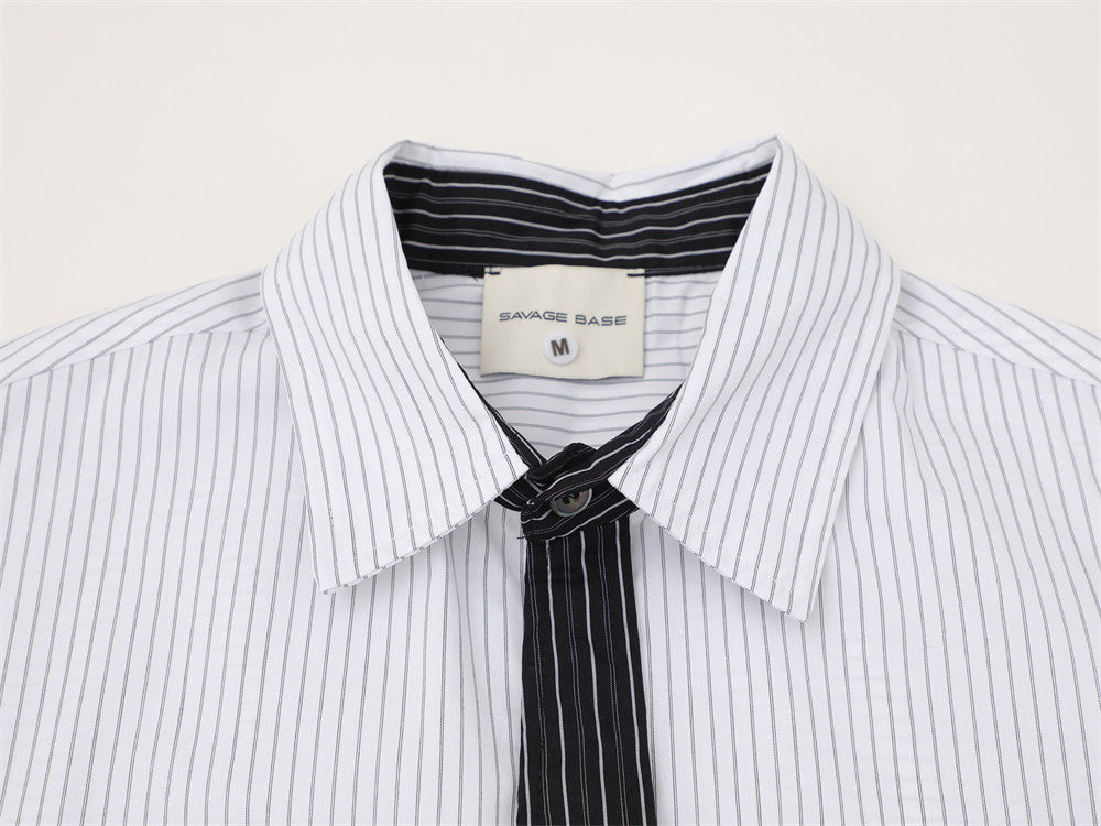 White striped collar and black contrast tie detail close-up
