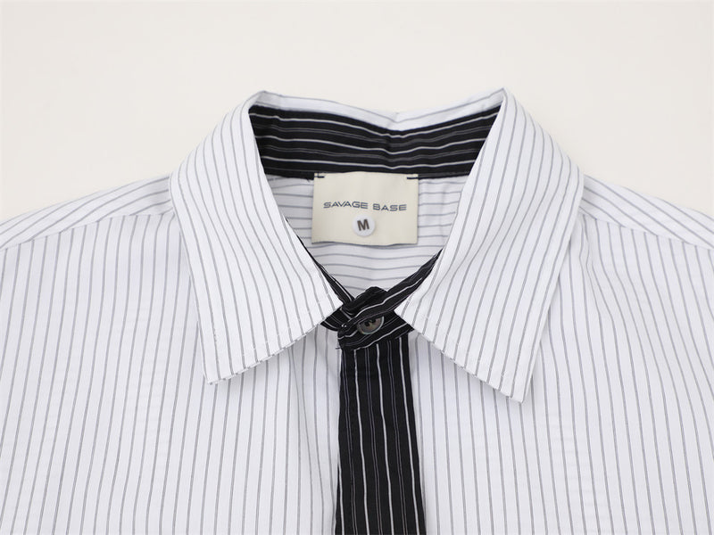 White striped collar and black contrast tie detail close-up
