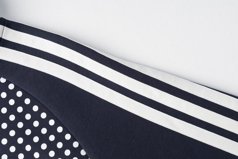 Veste de survêtement zippée à col montant, pois et manches à bandes