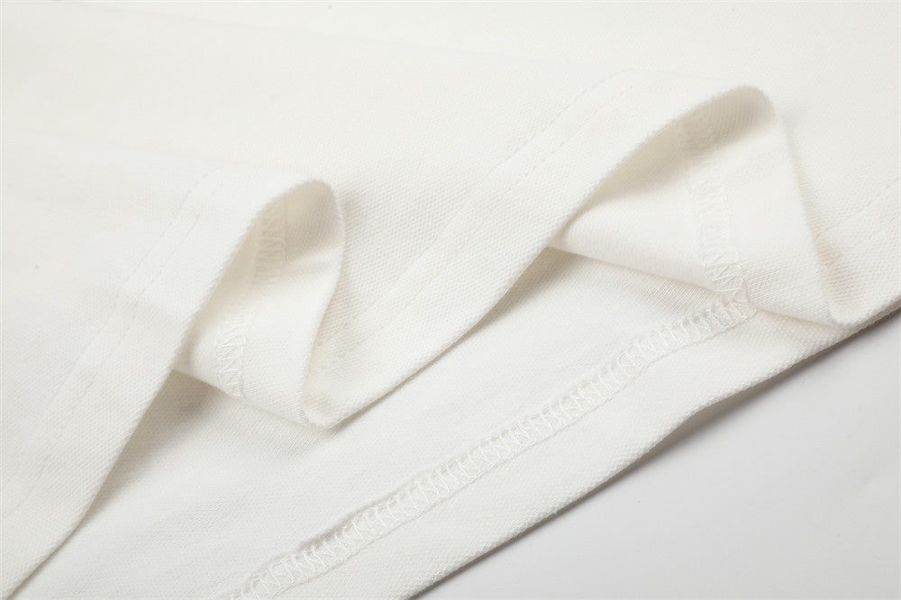 Close-up of white shirt inside hem stitching and folded edge