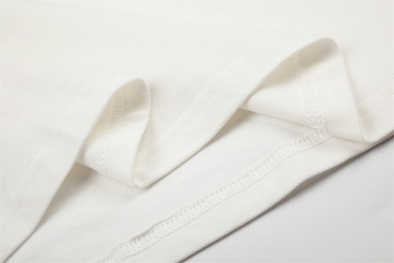 Close-up of white shirt inside hem stitching and folded edge