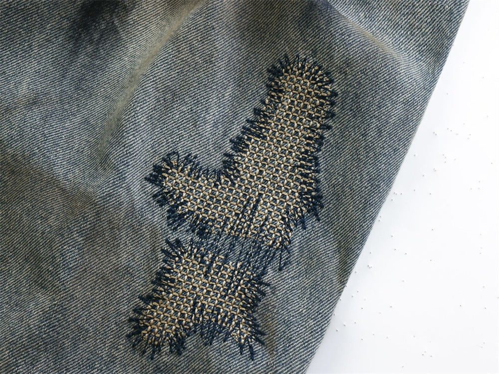 Baggy Wide-Leg Jeans – Chaotic Embroidery, Distressed Denim & Arc-Hem Design