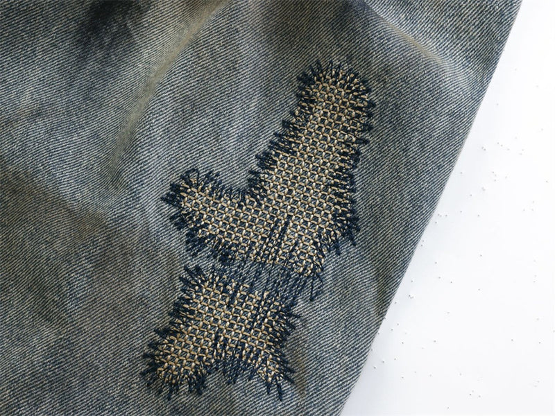 Baggy Wide-Leg Jeans – Chaotic Embroidery, Distressed Denim & Arc-Hem Design