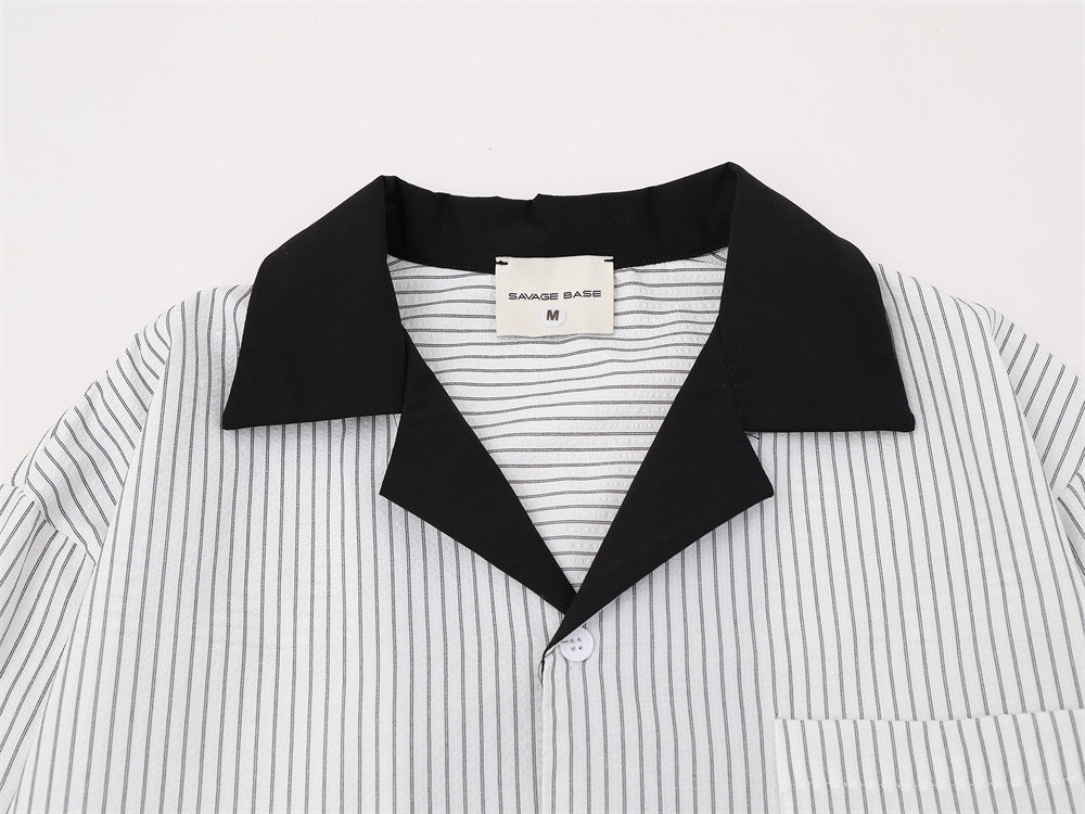 Close-up of white striped shirt front with black Cuban collar and chest pocket