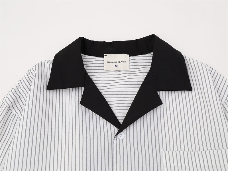 Close-up of white striped shirt front with black Cuban collar and chest pocket