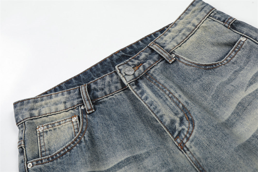 Vintage Washed Wide-Leg Flare Jeans – Distressed Faded Denim with Crease Detail