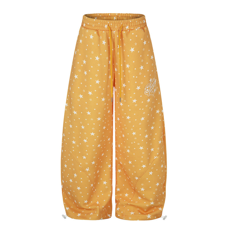 Oversized wide-leg star print sweatpants in orange with elasticated waist and ankle toggles