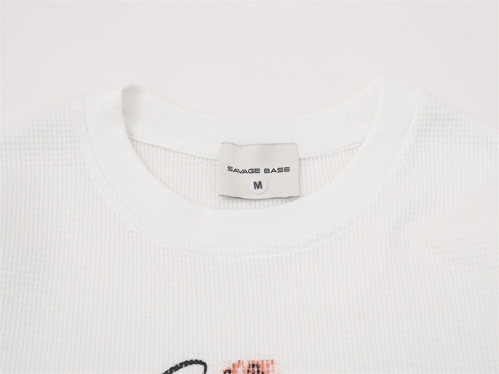 T-shirt graphique manches longues Savage Base – Col rond oversize en maille gaufrée