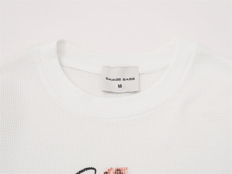 T-shirt graphique manches longues Savage Base – Col rond oversize en maille gaufrée