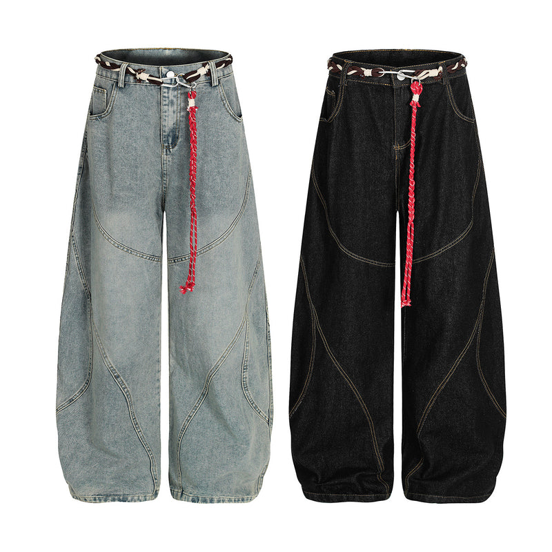 Vaqueros barrel de pierna ancha – Denim lavado con patchwork deconstruido y cinturón trenzado