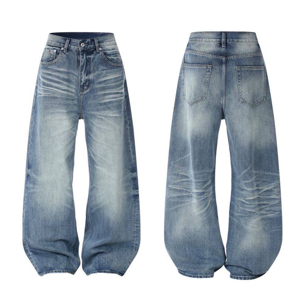 Men's relaxed fit wide-leg baggy jeans in vintage washed blue denim with crease and fade detailing, front and back view