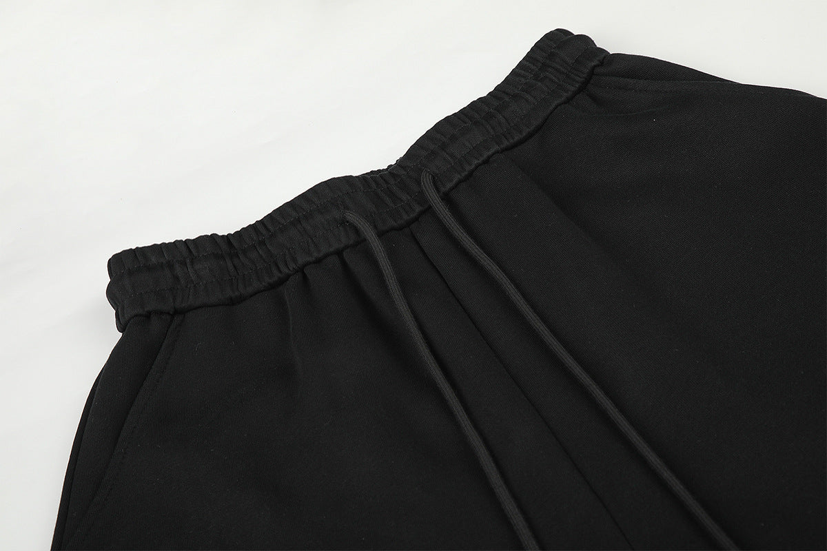 Pantalon de survêtement à jambes larges avec délavage dégradé et plis aux genoux