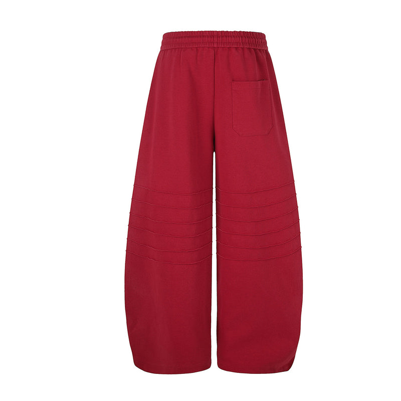 Pantalon de survêtement à jambes larges avec délavage dégradé et plis aux genoux