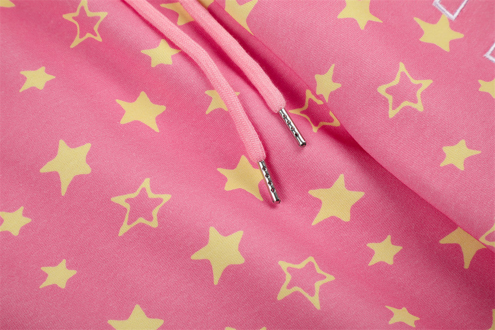 Close-up of pink star print sweatpants drawstring ends with star pattern
