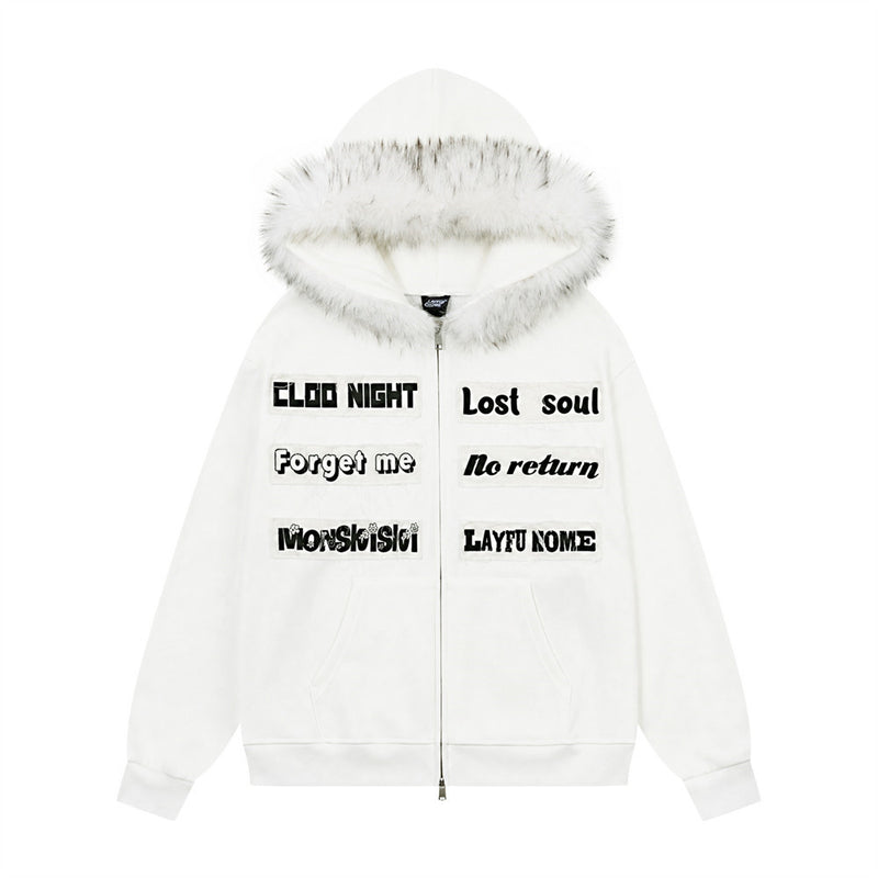 Oversized zip-up hoodie with faux-fur trim hood and letter patch appliqués in white, front view