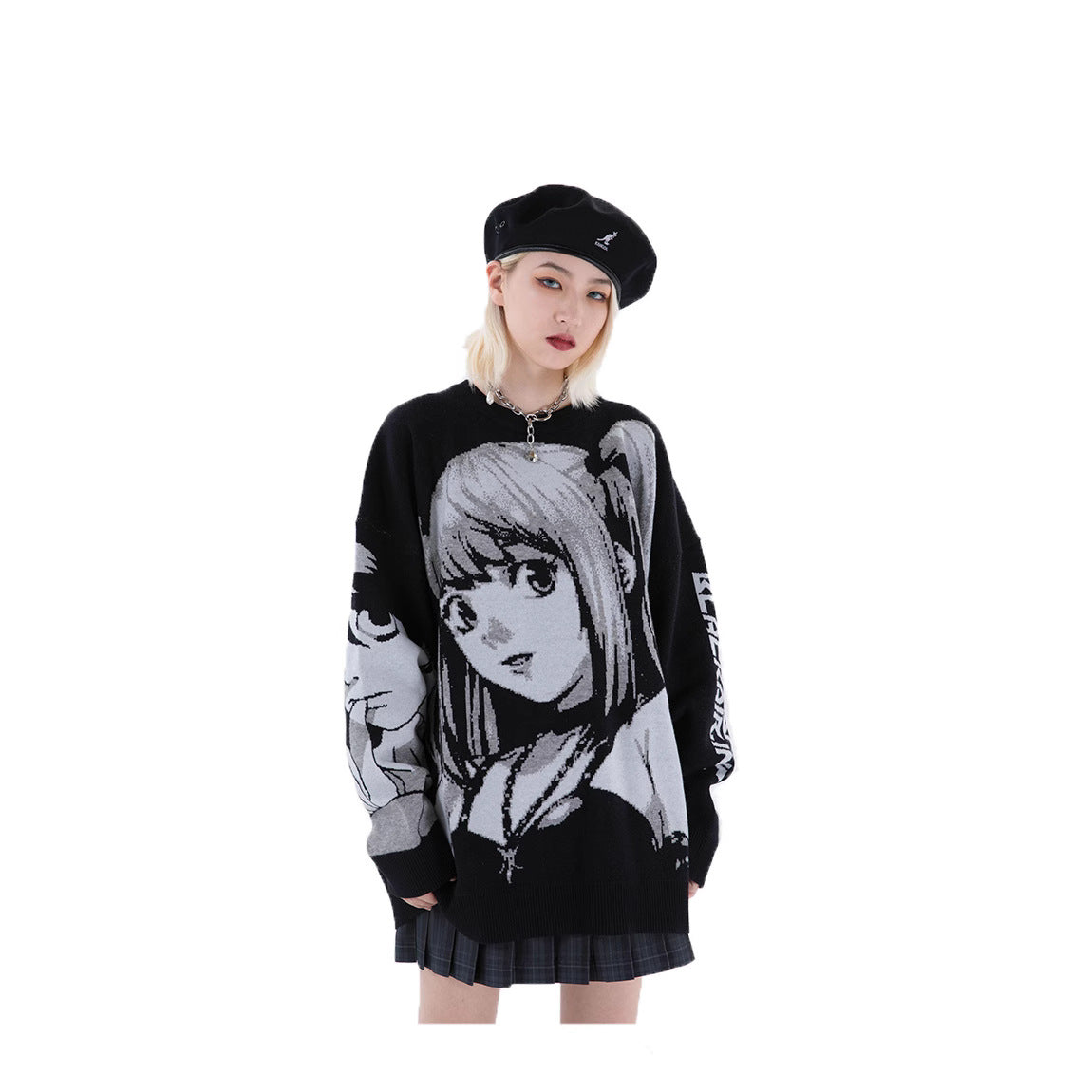 A person stands against a white background wearing a black beret and the Death Note Premium Knit Sweater with a Misa Amane Monochrome Jacquard design. They have blonde hair and wear a plaid skirt.