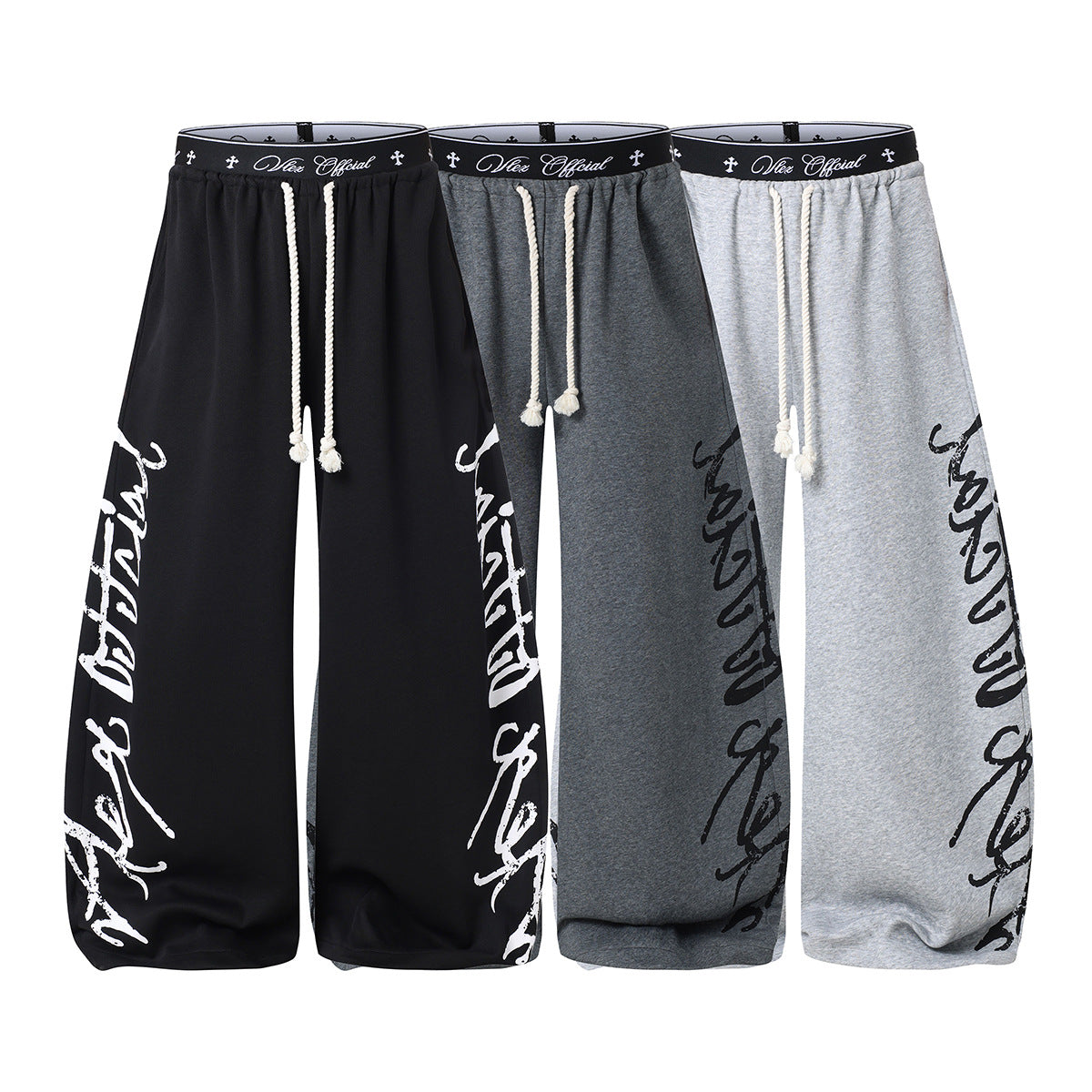 Pantalon de survêtement à jambes larges avec imprimé graffiti cursif et ceinture élastiquée siglée