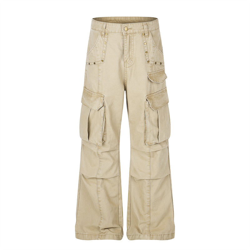 Beige wide-leg cargo pants front view with flap pockets and studded trim