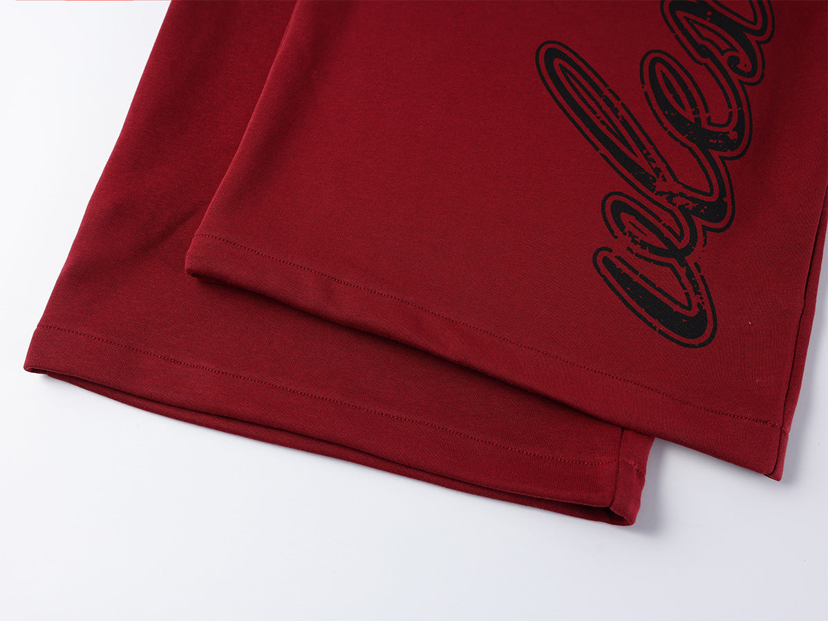 Pantalon de survêtement à jambes larges avec logo cursif et ceinture élastiquée