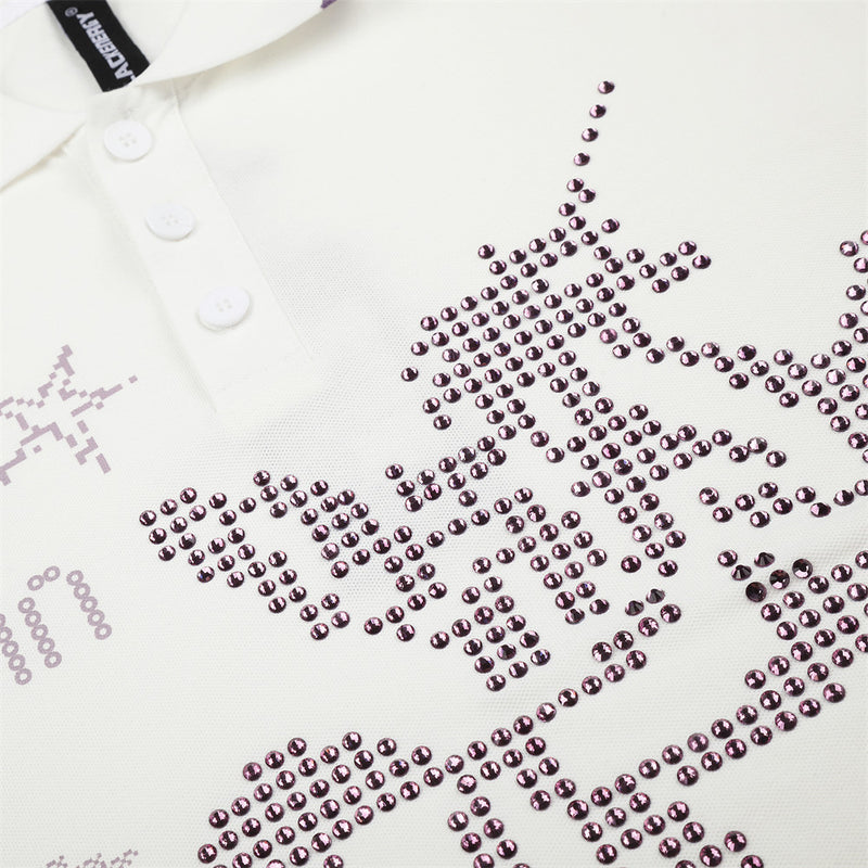 Close-up of pink rhinestone horse graphic on white polo shirt