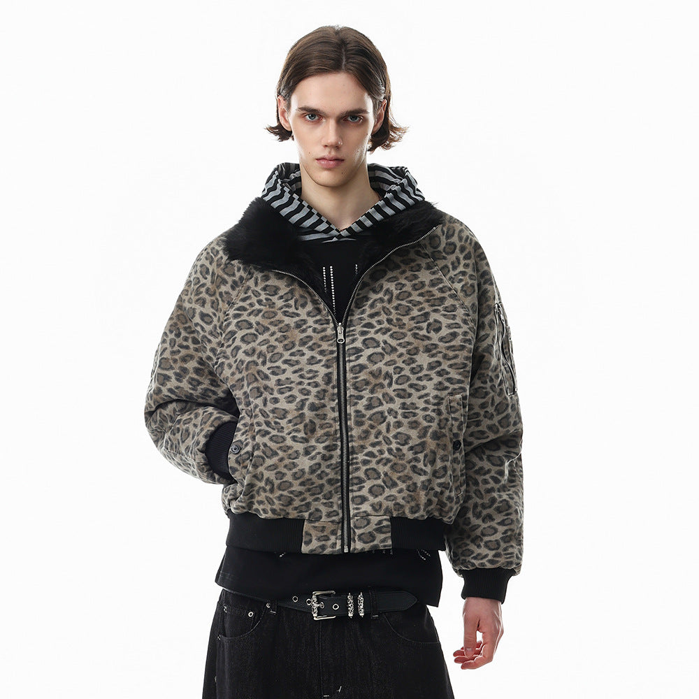 Men's reversible faux fur and leopard print oversized bomber jacket in black, shown on male model with stand collar open