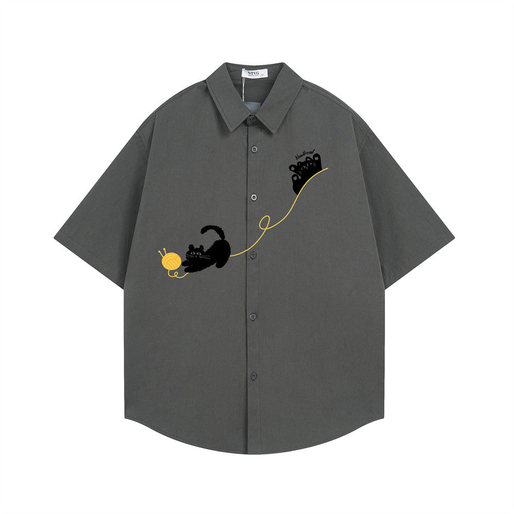 Men's relaxed fit short sleeve collared shirt with black cat and yarn ball embroidery on the front, shown in charcoal grey