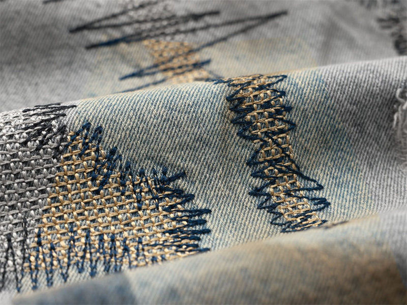 Men's Distressed Wide-Leg Jeans with Chaotic Embroidery & Metal Eyelet Detail