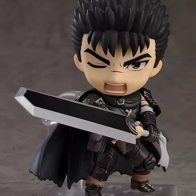 The Berserk Guts Nendoroid Action Figure, a 10 cm chibi PVC figurine, features spiky black hair, dark armor, and a black cape. With movable joints and faceplates, it wields a large sword with an intense expression. A must-have for any anime collection.