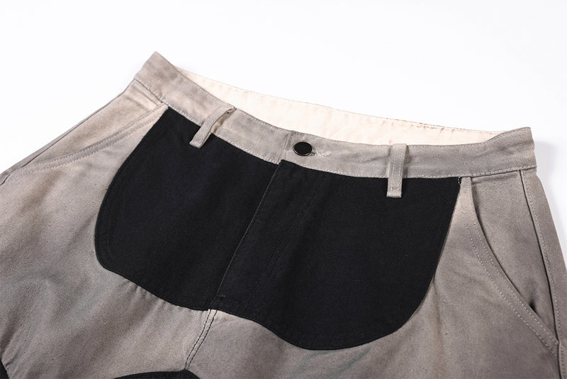Wide-Leg-Patchworkhose – abstraktes Wellenmuster aus zweifarbigem, schwarz-grauem Washed-Denim