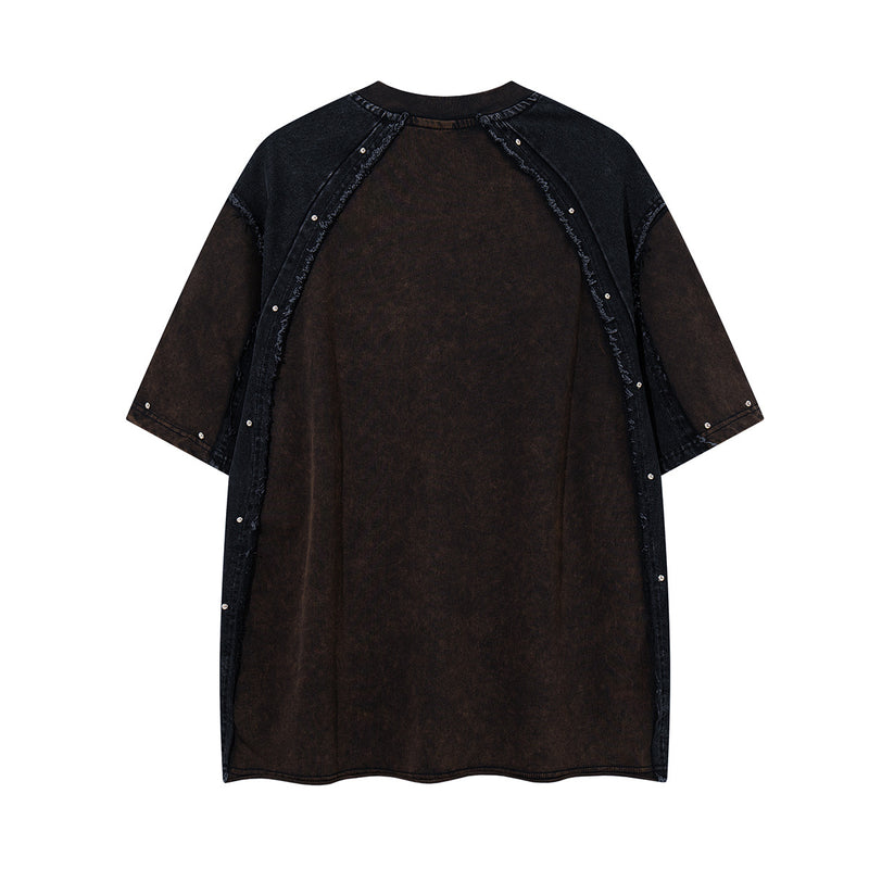 T-shirt patchwork raglan délavé à l’acide, coutures à bords bruts et détails rivetés