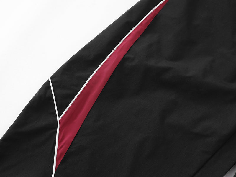 Herren-Trackpants mit kontrastierender Paspel und Colorblock-Seiteneinsätzen