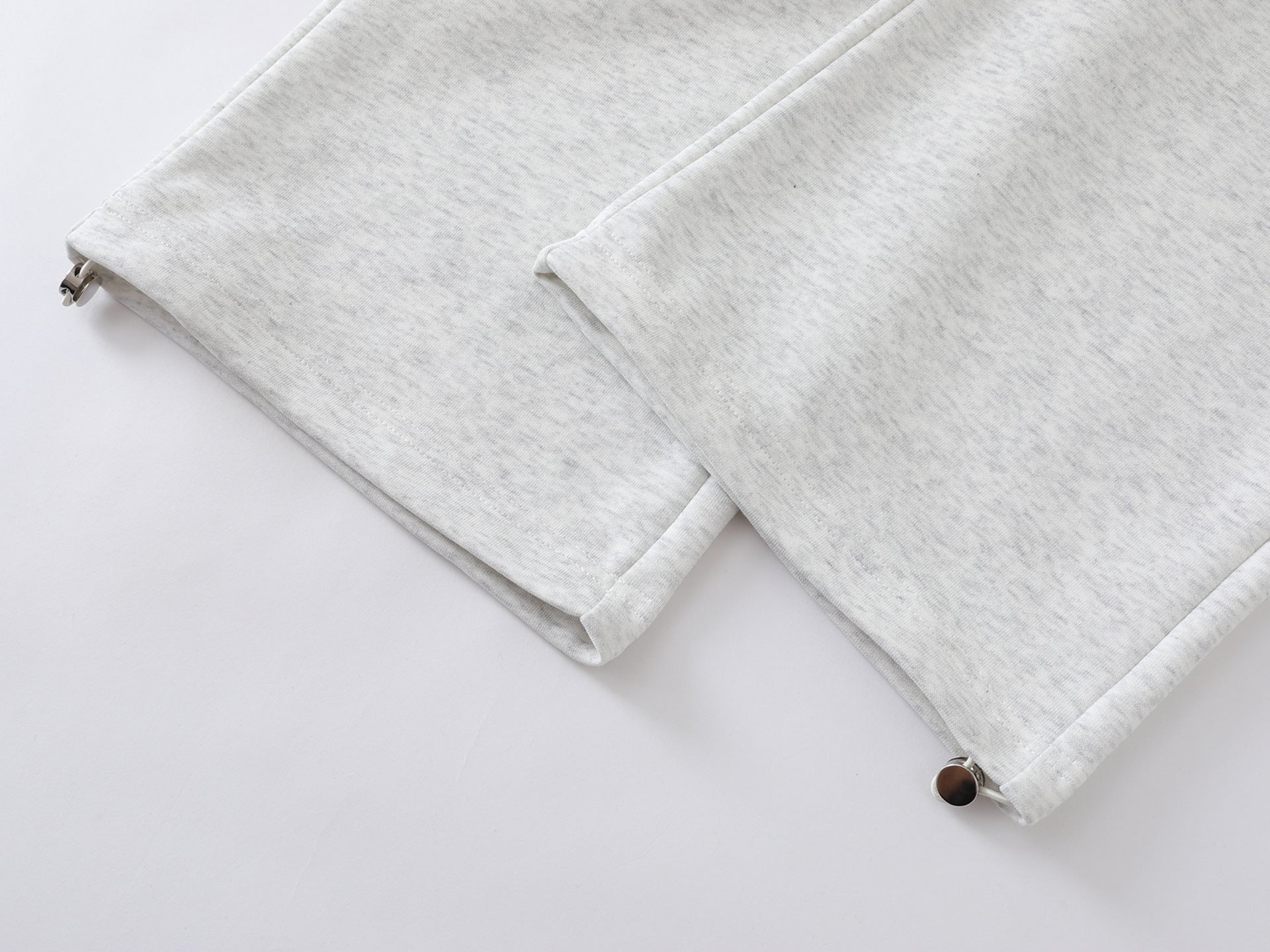 Pantalon de survêtement à jambes larges avec double ceinture et cordon tressé