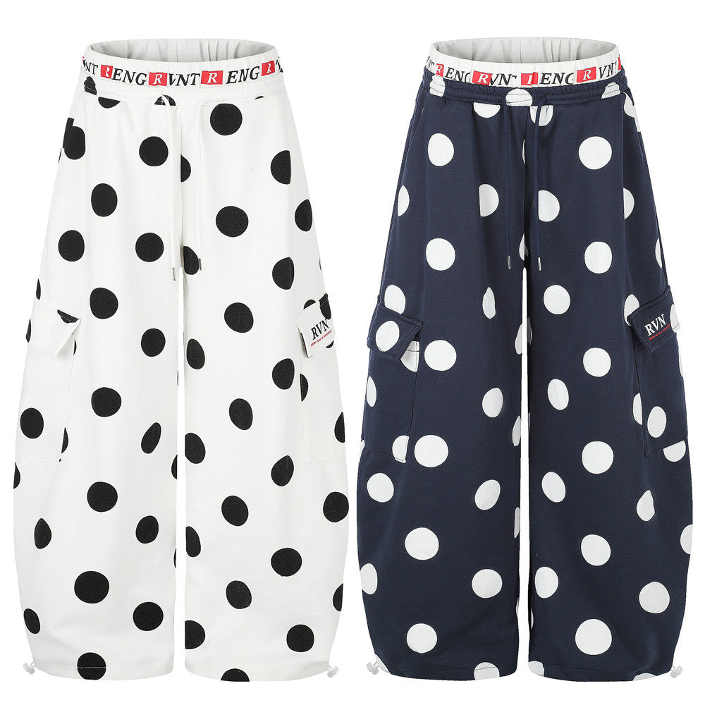 Oversized polka dot wide-leg cargo sweatpants in white with black dots and navy with white dots, featuring branded waistband