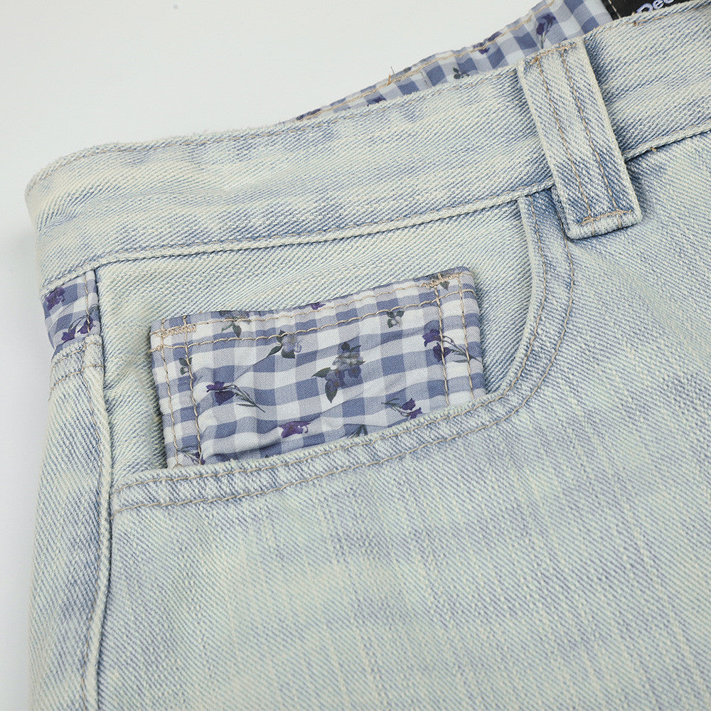 Jean homme à jambes larges, délavage clair, denim vintage déstructuré et empiècements vichy
