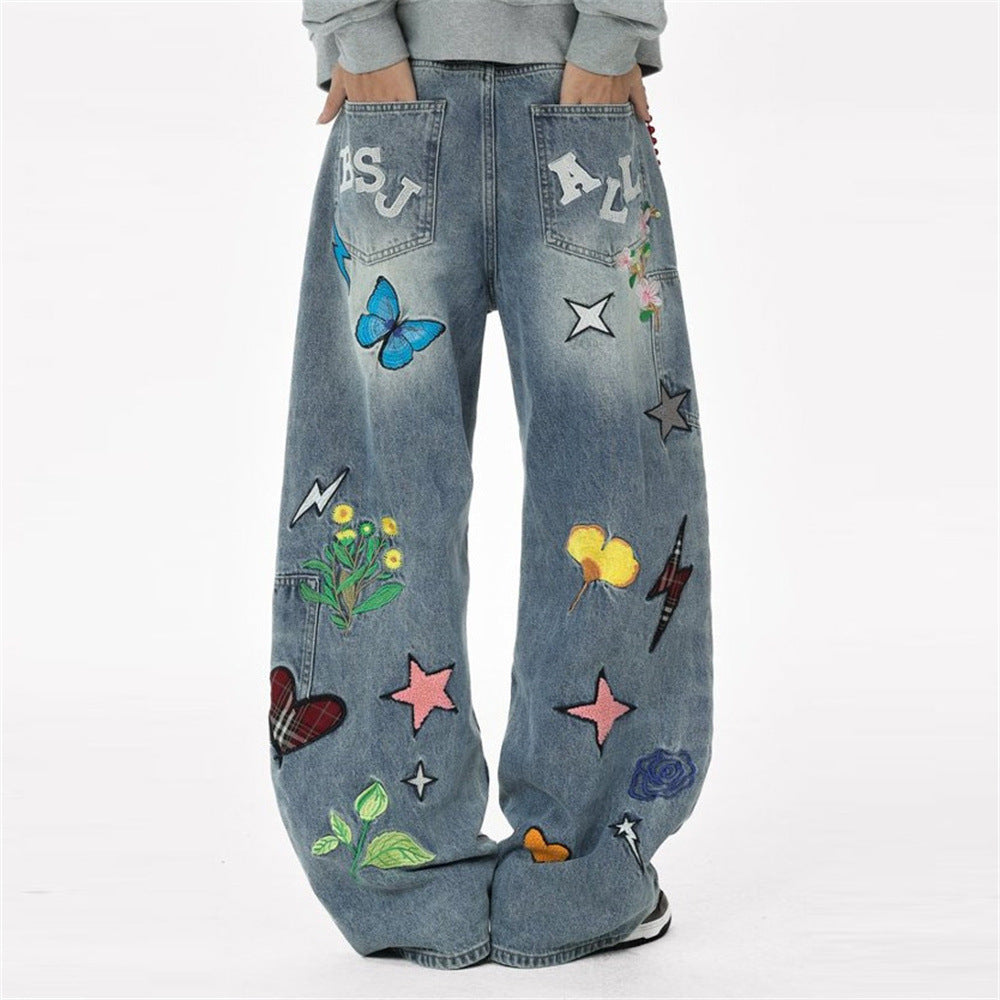 Vaqueros baggy de pierna ancha con flores bordadas, mariposas y motivos de patchwork