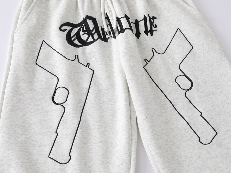 Pantalon de survêtement à jambes larges avec imprimé gothique « Welcome » et deux pistolets – Style streetwear hip-hop