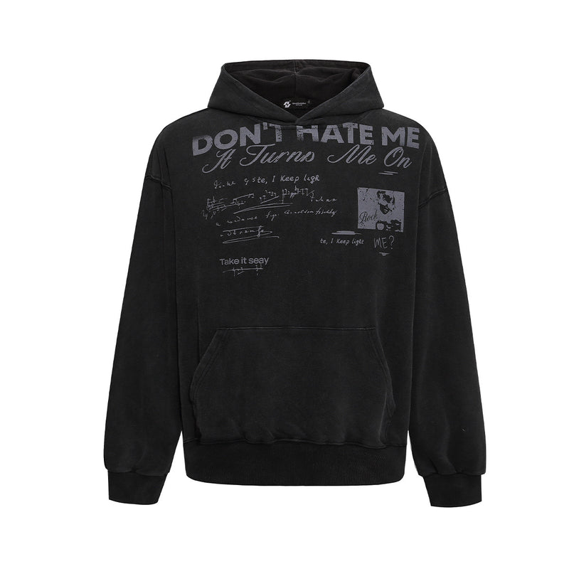 Oversized washed graphic hoodie with 'Don't Hate Me It Turns Me On' vintage rock slogan print in black and off-white