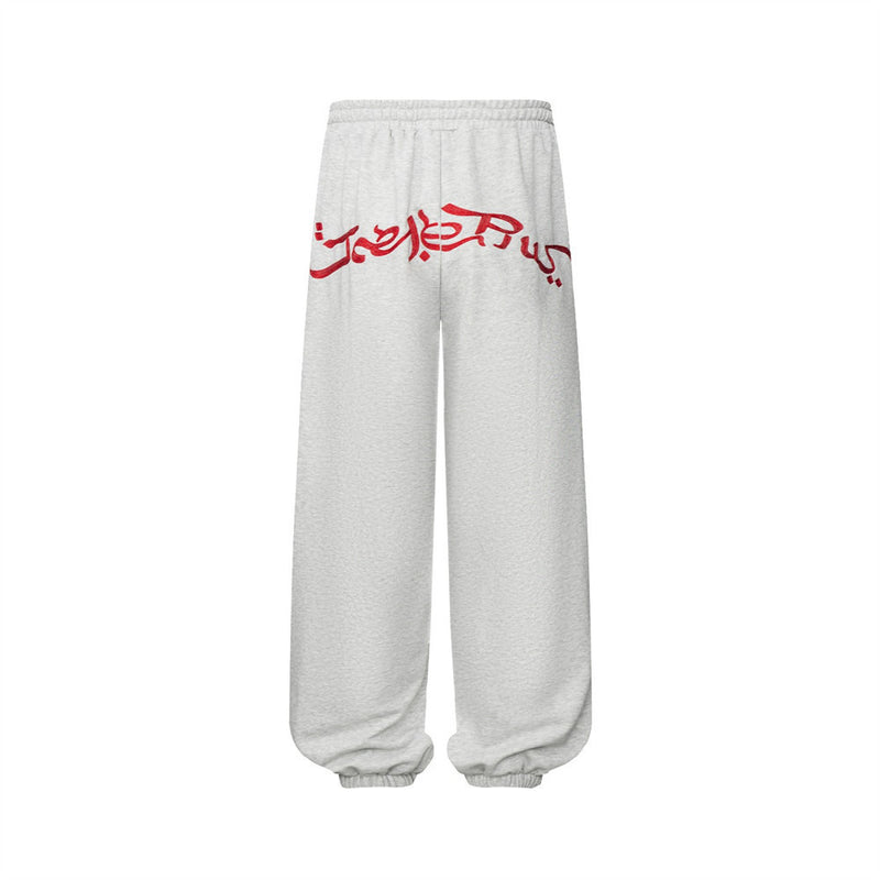 Pantalon de survêtement homme à jambes larges avec écusson brodé et imprimé graphique en écriture