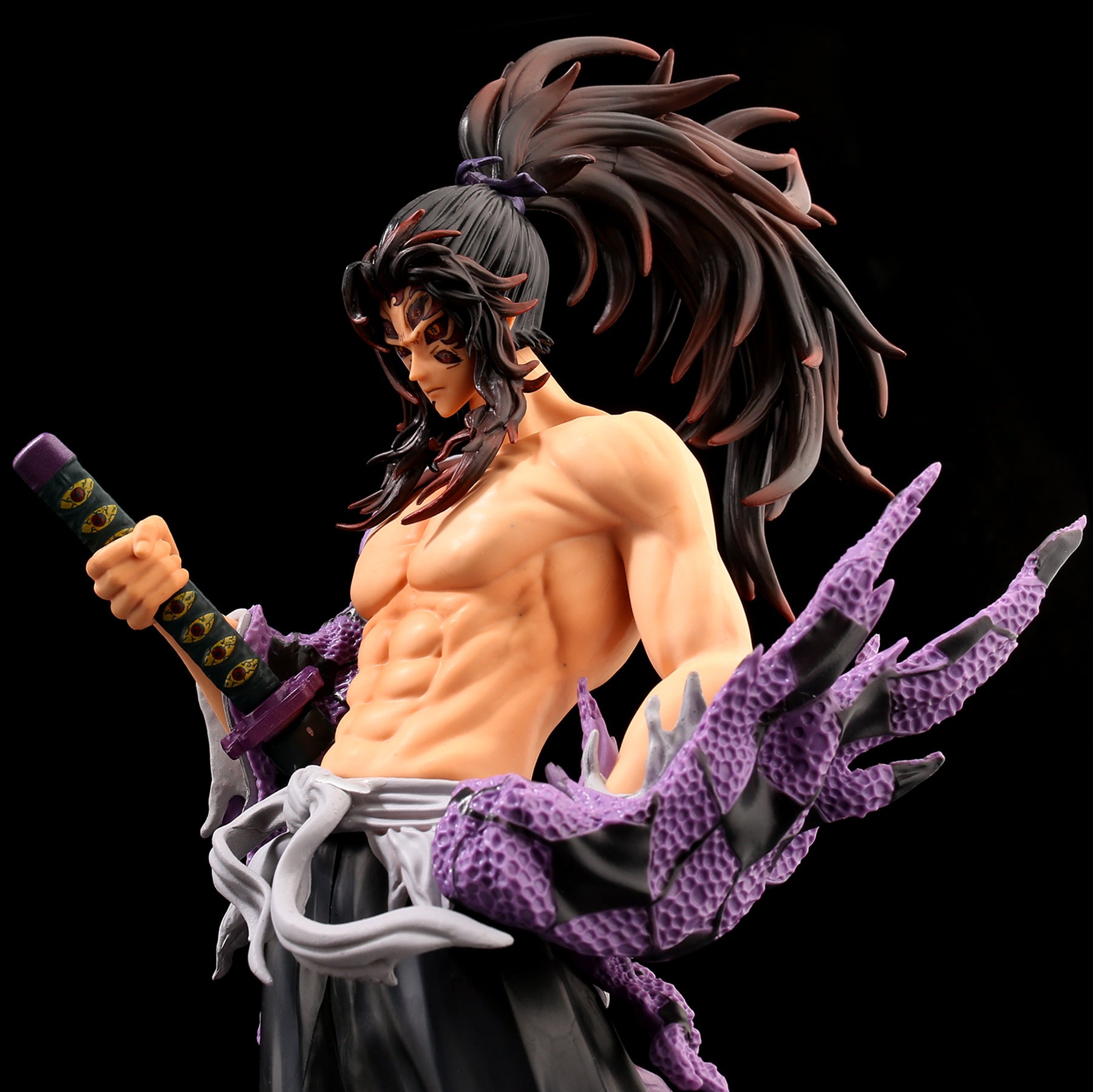 The 31CM PVC Kokushibo Demon Slayer Figure by Demon Slayer features an anime-style shirtless character with long hair in a high ponytail, wielding a sword with a detailed purple and black handle. Perfect for Kimetsu no Yaiba fans seeking an impressive collectible.