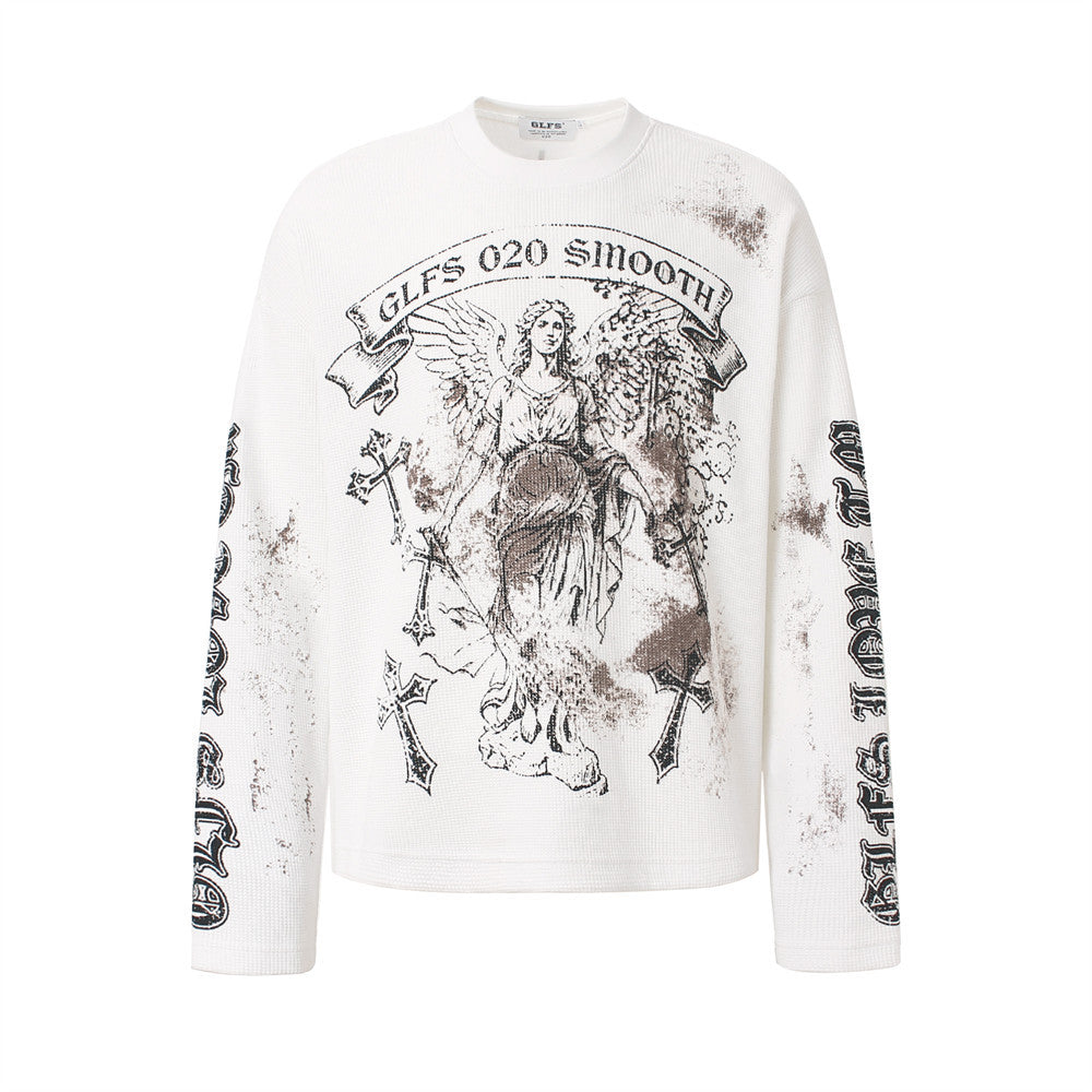 White waffle-knit long sleeve shirt with distressed angel and cross graphic print on chest and gothic lettering on sleeves