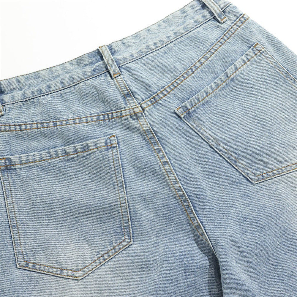 Back waistband and two patch pockets on light wash jeans